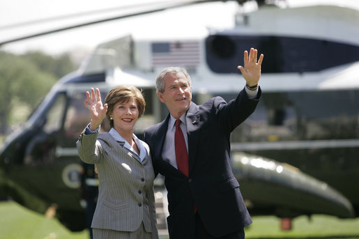 President George W. Bush and Mrs. Laura Bush wave to guests on the South Lawn Friday, May 12, 2006, before boarding Marine One en route Camp David. White House photo by Eric Draper