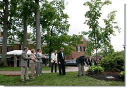 President George W. Bush and Australian Prime Minister John Howard participate in the presentation of White House trees at the Australian Ambassador's Residence, Sunday, May 14, 2006. White House photo by Eric Draper