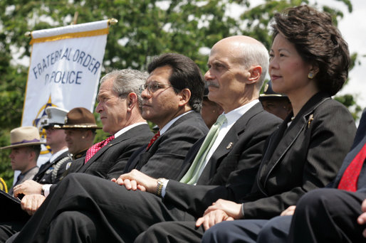 President George W. Bush sits with, from left, Attorney General Alberto Gonzales, Homeland Security Secretary Michael Chertoff and Labor Secretary Elaine Chao during the Annual Peace Officers' Memorial Service at the U. S. Capitol Monday, May 15, 2006. White House photo by Kimberlee Hewitt