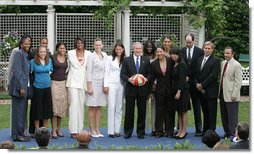 President George W. Bush poses with the Sacramento Monarchs, the 2005 Women's National Basketball Association Champions, Tuesday, May 16, 2006 during a congratulatory ceremony held in the East Garden at the White House. In September 2005, the Monarchs clinched their first WNBA Championship title by defeating the Connecticut Sun, 3 games to 1.  White House photo by Kimberlee Hewitt