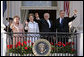 President George W. Bush, Prime Minister John Howard, Mrs. Laura Bush and Mrs. Janette Howard wave from the South Portico of the White House during the State Arrival Ceremony on the South Lawn Tuesday, May 16, 2006. White House photo by Paul Morse