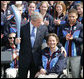 President George W. Bush is given an Olympic torch by Chris Devlin-Young, a U.S. Paralympic gold-medalist, during a South Lawn ceremony Wednesday, May 17, 2006, at the White House in honor of the 2006 U.S. Winter Olympics and Paralympics teams. White House photo by Shealah Craighead