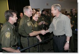 President George W. Bush greets U.S. Border Patrol agents after delivering remarks on border security and immigration reform at the U.S. Border Patrol Yuma Sector Headquarters in Yuma, Arizona, Thursday, May 18, 2006. White House photo by Eric Draper