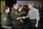 President George W. Bush greets U.S. Border Patrol agents after delivering remarks on border security and immigration reform at the U.S. Border Patrol Yuma Sector Headquarters in Yuma, Arizona, Thursday, May 18, 2006. White House photo by Eric Draper