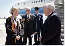 Upon landing in Louisana, Vice President Dick Cheney talks with Louisiana State University Student Body President Michelle Gieg and Chancellor Sean O'Keefe alongside Air Force Two. The vice president delivered the commencement address to over 3,000 bachelors, masters, and doctoral students.  White House photo by David Bohrer