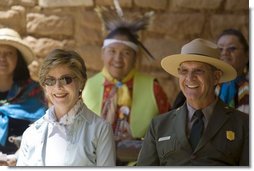 Mrs. Laura Bush and Mesa Verde National Park Superintendent Larry Wiese share a laugh, Thursday, May 23, 2006, during the celebration of the 100th anniversary of Mesa Verde and the Antiquities Act in Mesa Verde, Colorado. Also pictured are members of the Ute Mountain Ute Tribe.  White House photo by Shealah Craighead