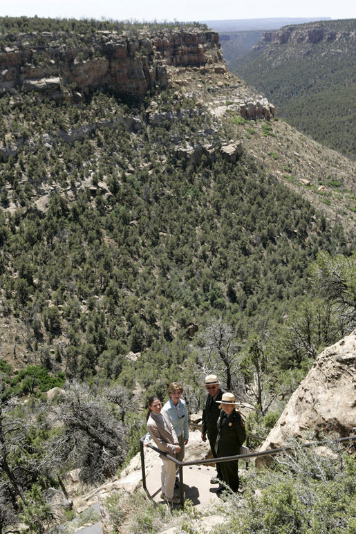 Mrs. Laura Bush pauses for a photo while hiking in Mesa Verde National Park in Colorado with, from left, Lynn Scarlett, Acting Secretary of the U.S. Department of Interior, Fran Mainella, Director, National Park Service and Larry Wiese, Superintendent of Mesa Verde National Park on Tuesday, May 23, 2006. Mesa Verde, founded as a national park on June 29, 1906, is celebrating its Centennial Anniversary this year. White House photo by Shealah Craighead