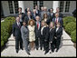 President George W. Bush stands with the President's Council on Physical Fitness and Sports in the Rose Garden Wednesday, May 24, 2006 at the White House. From left to right-front row:U.S. Secretary of Health and Human Services, Michael O. Leavitt; Dr. Lillian Green-Chamberlin; Donna Richardson Joyner; Dr. Dorothy Richardson; Melissa Johnson and Dr. Cathy Baase. Row Two: William Greer; John Burke; Charles Moore; Susan Dell and Kirk Bauer. Row Three: Tedd Mitchell; Dr. Ed Laskowski; Eli Manning; Jerry Noyce; Edgar Weldon; Paul Carrozza and Steve Bornstein. White House photo by Eric Draper