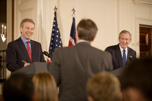 President George W. Bush and British Prime Minister Tony Blair participate in a joint news conference Thursday evening May 25, 2006 in the East Room of the White House, where the two leaders vowed their support to the new government of Iraq. White House photo by Eric Draper