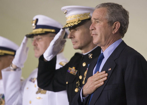 President George W. Bush participates in the Change of Command Ceremony for the Commandant of the U.S. Coast Guard Thursday, May 25, 2006. He stands onstage with General Peter Pace, Chairman, Joint Chiefs of Staff, and Admiral Thad Allen, the 23rd Commandant. White House photo by Eric Draper