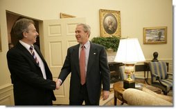 President George W. Bush greets Prime Minister Tony Blair of Great Britain in the Oval Office of the White House, Friday, May 26, 2006, during the second day of the Prime Minister's two-day visit. White House photo by Eric Draper