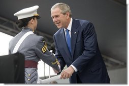 President George W. Bush presents a diploma to class valedictorian Jessamyn Jade Liu during 2006 graduation ceremonies Saturday, May 27, 2006, at the U.S. Military Academy in West Point, N.Y.  White House photo by Shealah Craighead