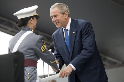 President George W. Bush presents a diploma to class valedictorian Jessamyn Jade Liu during 2006 graduation ceremonies Saturday, May 27, 2006, at the U.S. Military Academy in West Point, N.Y. White House photo by Shealah Craighead