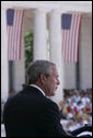 President George W. Bush delivers remarks during a Memorial Day ceremony held at the Arlington National Cemetery amphitheatre in Arlington, Va., Monday, May 29, 2006. White House photo by Paul Morse