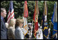 Mrs. Bush stands with Health and Human Services Secretary Mike Leavitt during a Memorial Day wreath laying ceremony at the Tomb of the Unknowns in Arlington National Cemetery in Arlington, Va., Monday, May 29, 2006. White House photo by Shealah Craighead