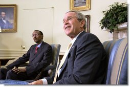 President George W. Bush and President Paul Kagame of Rwanda talk with the press during their meeting in the Oval Office Wednesday, May 31, 2006. White House photo by Paul Morse
