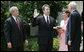 President George W. Bush looks on as Justice Anthony Kennedy swears in Brett Kavanaugh to the U.S. Court of Appeals for the District of Columbia during a ceremony Thursday, June 1, 2006, in the Rose Garden. Mrs. Ashley Kavanaugh holds the Holy Bible. White House photo by Eric Draper