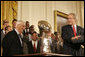 President George W. Bush addresses his remarks to Pittsburgh Steelers owner Dan Rooney as he welcomes the Super Bowl Champion Pittsburgh Steelers to the White House, Friday, June 2, 2006, during a ceremony in the East Room to honor the Super Bowl champs. White House photo by Eric Draper