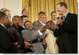 Pittsburgh Steeler Jerome Bettis, center, joins his teammates in a humorous moment with their coach Bill Cowher as the Super Bowl Champion Pittsburgh Steelers are honored at the White House, Friday, June 2, 2006, during a ceremony in the East Room. White House photo by Eric Draper
