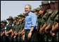 President George W. Bush joins U.S. Border Patrol agents on stage before delivering remarks on border security at the Federal Law Enforcement Training Center Artesia Facility in Artesia, New Mexico, Tuesday, June 6, 2006. White House photo by Eric Draper