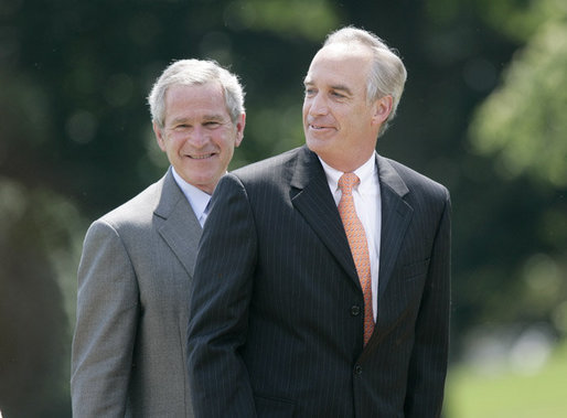 President George W. Bush invites former Idaho Gov. Dirk Kempthorne to the podium, after Kempthorne’s swearing-in ceremony as the new U.S. Secretary of Interior, Wednesday, June 7, 2006 on the South Lawn of the White House in Washington. White House photo by Eric Draper