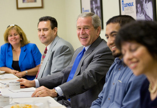 President George W. Bush visits with community leaders during a micro business networking breakfast at Catholic Charities – Juan Diego Center in Omaha, Nebraska, Wednesday, June 7, 2006. White House photo by Eric Draper