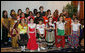 Mrs. Laura Bush poses with members of the St. Catherine Laboure School’s Cultural Hertiage Choir, Thursday, June 8, 2006 at the President’s Malaria Initiative conference at the National Press Club in Washington. The choir, dressed in heritage costumes, consists of students from first grade to eighth grade representing 20 nations. White House photo by Shealah Craighead