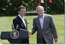 President George W. Bush and Prime Minister Anders Fogh Rasmussen of Denmark meet at Camp David Friday, June 9, 2006. White House photo by Eric Draper