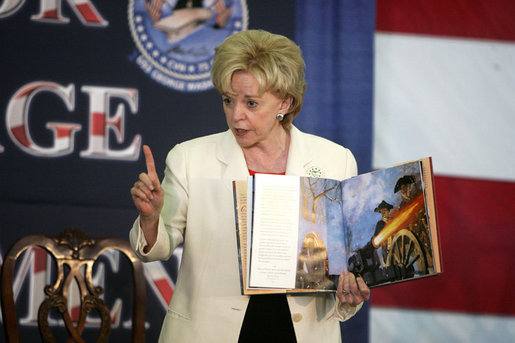 Mrs. Lynne Cheney tells the story of George Washington crossing the Delaware River, Saturday, June 10, 2006, to the children of the officers and crew aboard the aircraft carrier USS George Washington docked at Norfolk Naval Station in Norfolk, Virginia. White House photo by David Bohrer