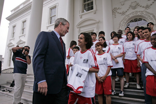 President George W. Bush talks with Imane Sallah from Morocco of the World Cup Soccer Youth Delegation on the North Portico steps of the White House Monday, June 12, 2006. The delegation is comprised of 30 soccer players representing 13 countries. White House photo by Paul Morse