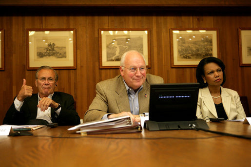 Vice President Dick Cheney is seated with Secretary of State Condoleezza Rice and Secretary of Defense Donald Rumsfeld as they participate in a video teleconference from Camp David, Md., Tuesday, June 13, 2006 with President Bush and Iraqi Prime Minister Nouri al-Maliki in Baghdad. White House photo by David Bohrer