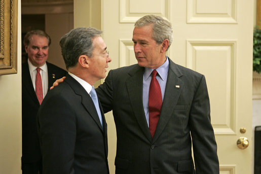 President George W. Bush welcomes Colombian President Alvaro Uribe to the Oval Office Wednesday, June 14, 2006. White House photo by Paul Morse