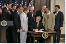 President George W. Bush signs S. 193, the Broadcast Decency Enforcement Act of 2005, in the Dwight D. Eisenhower Executive Office Building Thursday, June 15, 2006. White House photo by Eric Draper