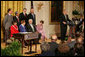 President George W. Bush addresses invited guests in the East Room of the White House prior to signing a proclamation to create the Northwestern Hawaiian Islands Marine National Monument, Wednesday, June 15, 2006.The proclamation will bring nearly 140,000 square miles of the Northwestern Hawaiian Island Coral Reef Ecosystem under the nation's highest form of marine environmental protection. Mrs. Laura Bush joined the President and distinguished guests on stage, seated from left to right, Hawaii Gov. Linda Lingle; marine biologist Sylvia Earle; and documentary filmmaker Jean-Michel Cousteau, Standing ,left to right, are U.S. Rep. Ed Case, D-Hawaii; U.S. Sen. Daniel Akaka, D-Hawaii; U.S. Commerce Secretary Carlos Gutierrez and U.S. Interior Secretary Dirk Kempthorne. White House photo by Shealah Craighead