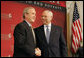 President George W. Bush is introduced by former Secretary of State Colin Powell at the Initiative for Global Development's 2006 National Summit in Washington, D.C., Thursday, June 15, 2006. "We have a moral duty to care for those who hurt here at home, and we have a moral duty to care for those as best as we can for those abroad, said the President. "That's part of the foreign policy of our country." White House photo by Kimberlee Hewitt