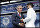 President George W. Bush greets graduates as they receive their degrees during the graduation ceremony at the United States Merchant Marine Academy at Kings Point, New York, Monday, June 19, 2006. White House photo by Kimberlee Hewitt