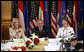 President George W. Bush and Laura Bush are joined by U.S. Ambassador to Austria Susan McCaw during a roundtable discussion Wednesday, June 21, 2006, with foreign students at the National Library in Vienna. White House photo by Eric Draper