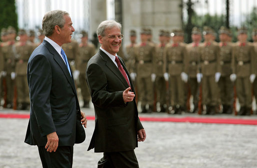 Hungarian President Laszlo Solyom and President George W. Bush review the Hungarian troops during an arrival ceremony at Sandor Palace in Budapest, Hungary, Thursday, June 22, 2006. White House photo by Shealah Craighead