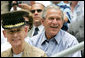 President George W. Bush is joined by General Peter Pace, chairman of the Joint Chiefs of Staff and Tee Ball Commissioner for the opening Tee Ball game of the 2006 season on the South Lawn of the White House, Friday, June 23, 2006, between the McGuire AFB Little League Yankees and the Dolcom Little League Indians of the Naval Submarine Base from Groton, Ct.  White House photo by Shealah Craighead