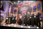 President George W. Bush and Mrs. Laura Bush are joined on stage by the cast of entertainers performing at the annual Ford's Theater gala to benefit the historic theater. The program, "An American Celebration at Ford's Theater," will be televised on July 4, 2006. White House photo by Kimberlee Hewitt