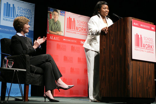 Mrs. Laura Bush applauds Caitlyn Clarke, high school Student of the Year for Jefferson Parish Public School System, Monday, June 26, 2006, as Miss Clarke speaks of her passion for reading before introducing Mrs. Bush during the 2006 American Library Association Conference in New Orleans, Louisiana. White House photo by Shealah Craighead