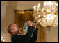 Composer and trumpeter Irvin Mayfield performs in the East Room of the White House Monday, June 26, 2006, as part of the Black Music Month celebration focusing on the music of the Gulf Coast: Blues, Jazz and Soul. White House photo by Eric Draper