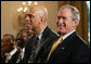 President George W. Bush is joined by basketball Hall of Famer Kareem Abdul Jabbar in the East Room of the White House Monday, June 26, 2006, as they listen to performer Patti Austin at the Black Music Month celebration focusing on the music of the Gulf Coast: Blues, Jazz and Soul. White House photo by Eric Draper