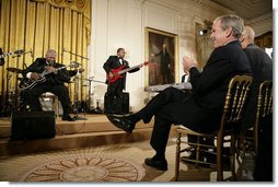 Legendary Blues guitarist B.B. King is applauded by President George W. Bush during King's performance in the East Room of the White House Monday, June 26, 2006, as part of the Black Music Month celebration focusing on the music of the Gulf Coast: Blues, Jazz and Soul. White House photo by Eric Draper