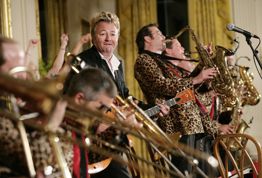 Guitarist-singer Brian Setzer plays with his orchestra Thursday evening, June 29, 2006 in the East Room of the White House, during the entertainment following the official dinner in honor of Japanese Prime Minister Junichiro Koizumi’s visit to the United States. White House photo by Eric Draper