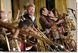 Guitarist-singer Brian Setzer plays with his orchestra Thursday evening, June 29, 2006 in the East Room of the White House, during the entertainment following the official dinner in honor of Japanese Prime Minister Junichiro Koizumi’s visit to the United States. White House photo by Eric Draper