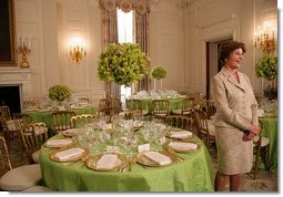 Mrs. Laura Bush discusses the motifs and entertainment for the official dinner honoring His Excellency Junichiro Koizumi, Prime Minister of Japan, in the State Dining Room during a media preview Thursday, June 29, 2006. "I think it's going to be a very fun evening," said Mrs. Bush. "Our orchestra is the Brian Setzer Orchestra. He'll play a lot of both the President's and Prime Minister Koizumi's favorites, and he's especially known for his guitar. So I think that will be terrific."  White House photo by Shealah Craighead
