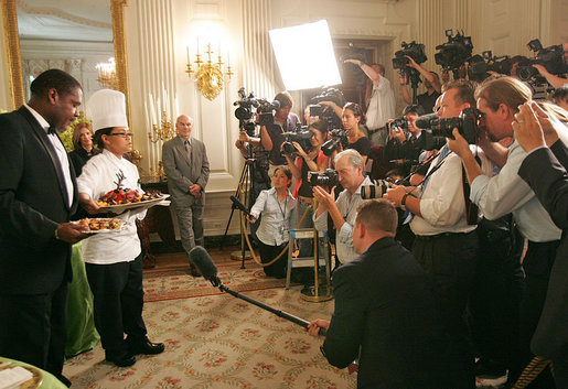White House Executive Chef Cristeta Comerford discusses the evening's menu with the press in the State Dining Room Thursday, June 29, 2006. The entrée for the dinner is Texas Kobe Beef with cracked black pepper, shitake mushroom jus, silver corn pilaf and sesame-coated wild asparagus. White House photo by Shealah Craighead