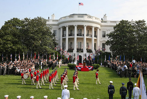 The U.S. Army Old Guard Fife and Drum Corps marches across the South Lawn during the official arrival ceremony for Prime Minister Junichiro Koizumi of Japan Thursday, June 29, 2006. White House photo by Kris Tripplaar