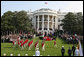 The U.S. Army Old Guard Fife and Drum Corps marches across the South Lawn during the official arrival ceremony for Prime Minister Junichiro Koizumi of Japan Thursday, June 29, 2006. White House photo by Kris Tripplaar